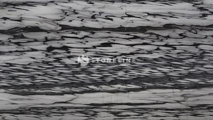 Close-up of textured black and white marble surface.