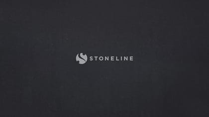 Dark textured surface with subtle variations.