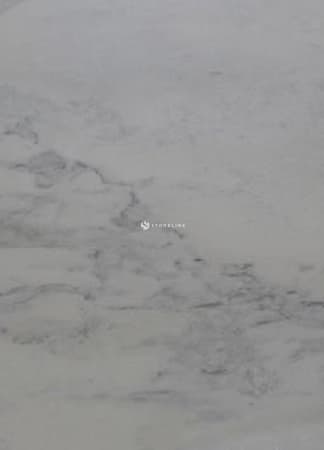 Close-up of light gray stone texture surface.